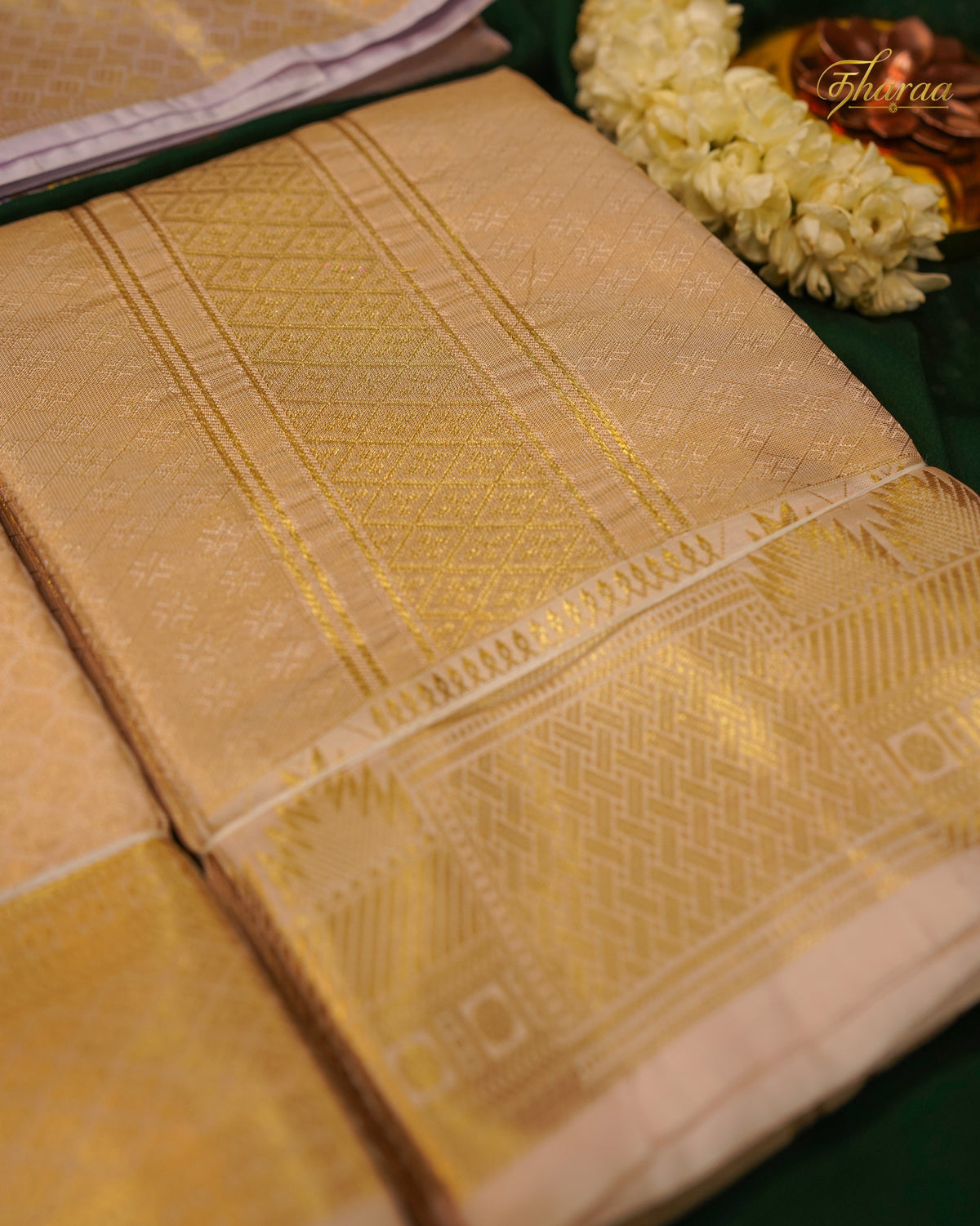 HEMAVARMAN dhoti is crafted from semi-silk fabric with a gold border and embossed design, combining durability and traditional aesthetics. Its semi-silk composition provides a balanced texture and sheen, suitable for formal occasions. The gold border enhances visual appeal while maintaining structural