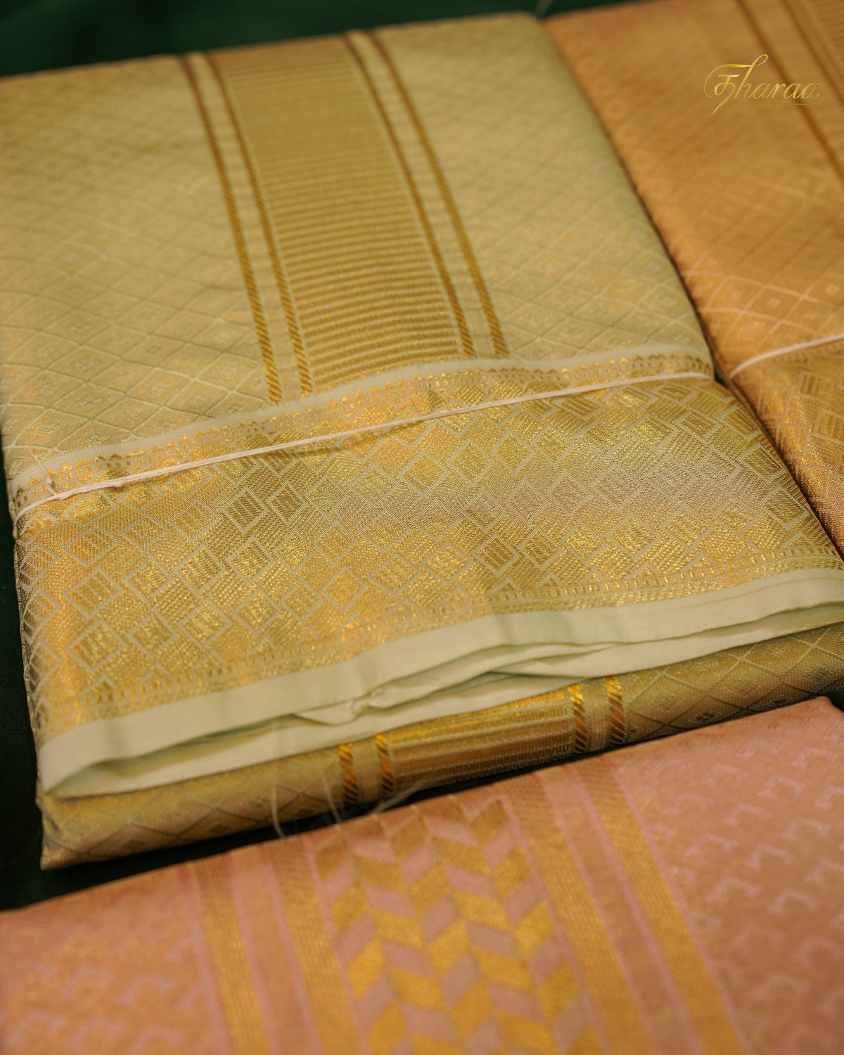 HEMAVARMAN dhoti is crafted from semi-silk fabric with a gold border and embossed design, combining durability and traditional aesthetics. Its semi-silk composition provides a balanced texture and sheen, suitable for formal occasions. The gold border enhances visual appeal while maintaining structural